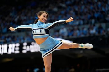 Feb 3, 2024; Chapel Hill, North Carolina, USA;  North Carolina Tar Heels cheerleader performs in the second half at Dean E. Smith Center. Mandatory Credit: Bob Donnan-Imagn Images