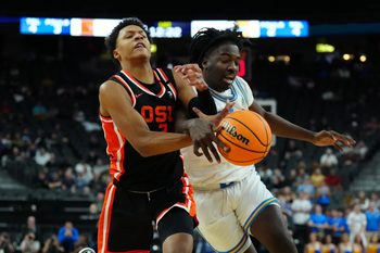 Mar 13, 2024; Las Vegas, NV, USA; Oregon State Beavers guard Josiah Lake II (2) and UCLA Bruins guard Will McClendon (4) battle for the ball in the first half  at T-Mobile Arena. Mandatory Credit: Kirby Lee-Imagn Images