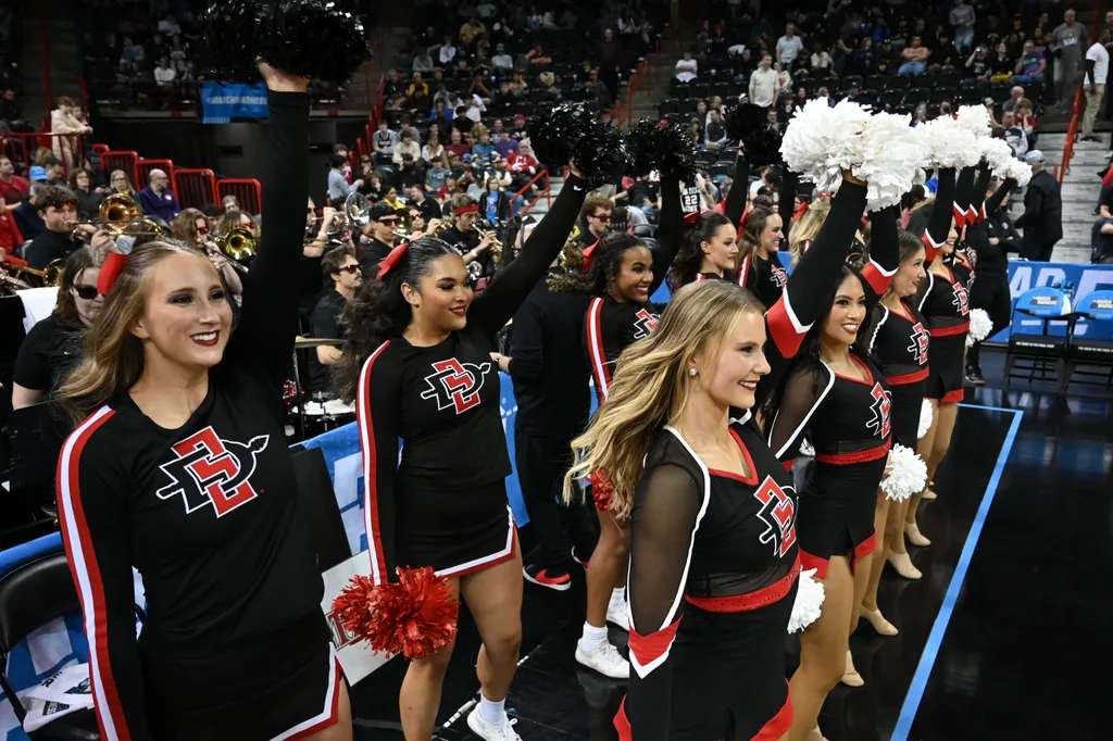 Mar 24, 2024; Spokane, WA, USA; San Diego State Aztecs cheerleaders preform in the second half against the Yale Bulldogs at Spokane Veterans Memorial Arena. Mandatory Credit: James Snook-Imagn Images