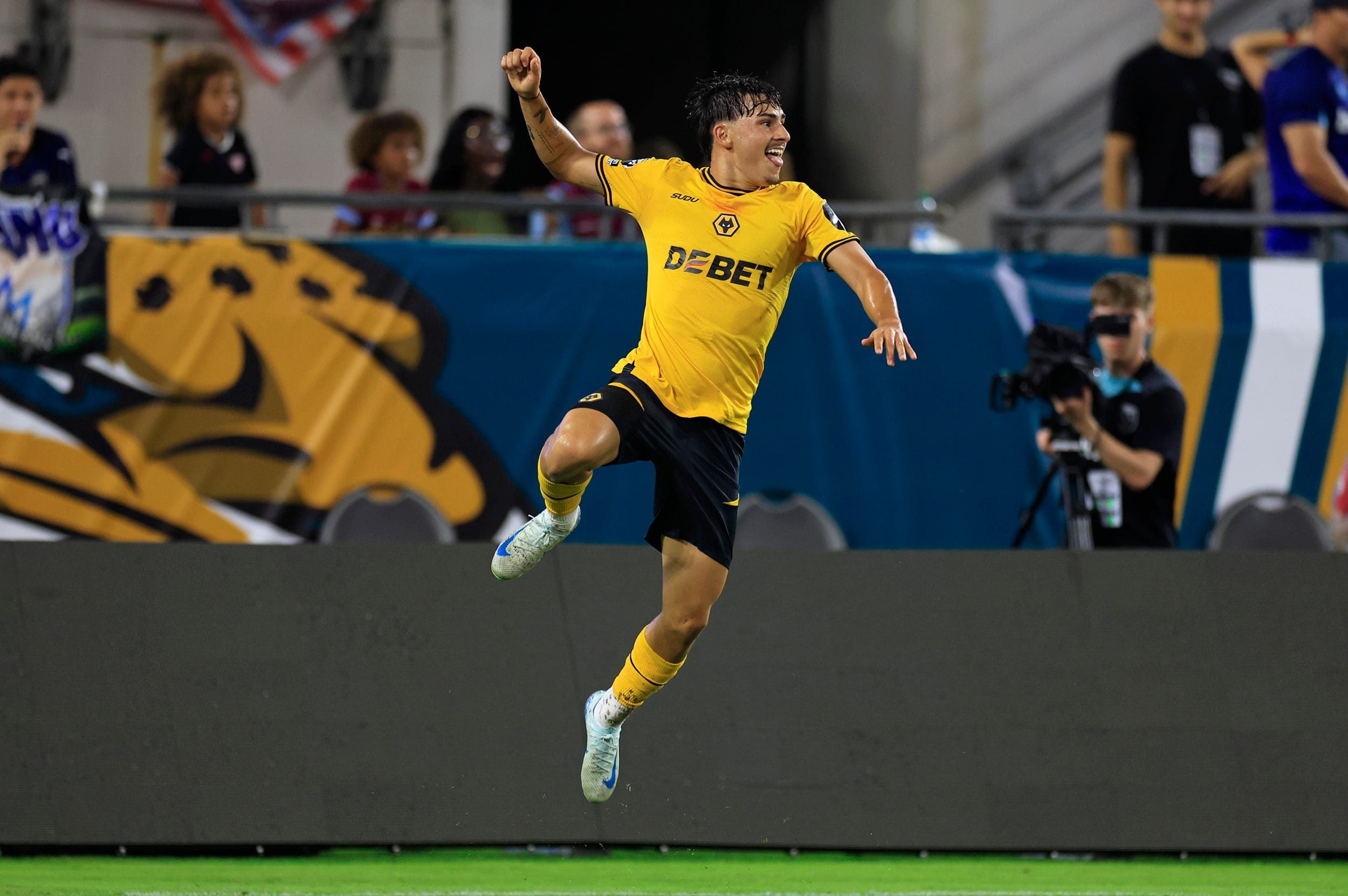 Wolverhampton Wanderers forward Rodrigo Gomes (19) reacts to scoring the goal to take the lead 2-1against West Ham United goalkeeper Wes Foderingham (21), not shown, during the second half of The Stateside Cup soccer tournament game Saturday, July 27, 2024 at EverBank Stadium in Jacksonville, Fla. The Wolverhampton Wanderers defeated West Ham United 3-1 in exhibition play.