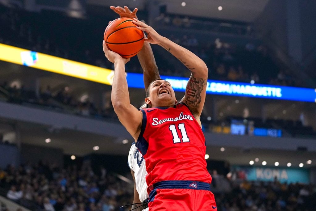 Nov 4, 2024; Milwaukee, Wisconsin, USA; Stony Brook Seawolves guard-forward Nick Woodard (11) shoots during the first half against the Marquette Golden Eagles at Fiserv Forum. Mandatory Credit: Jeff Hanisch-Imagn Images