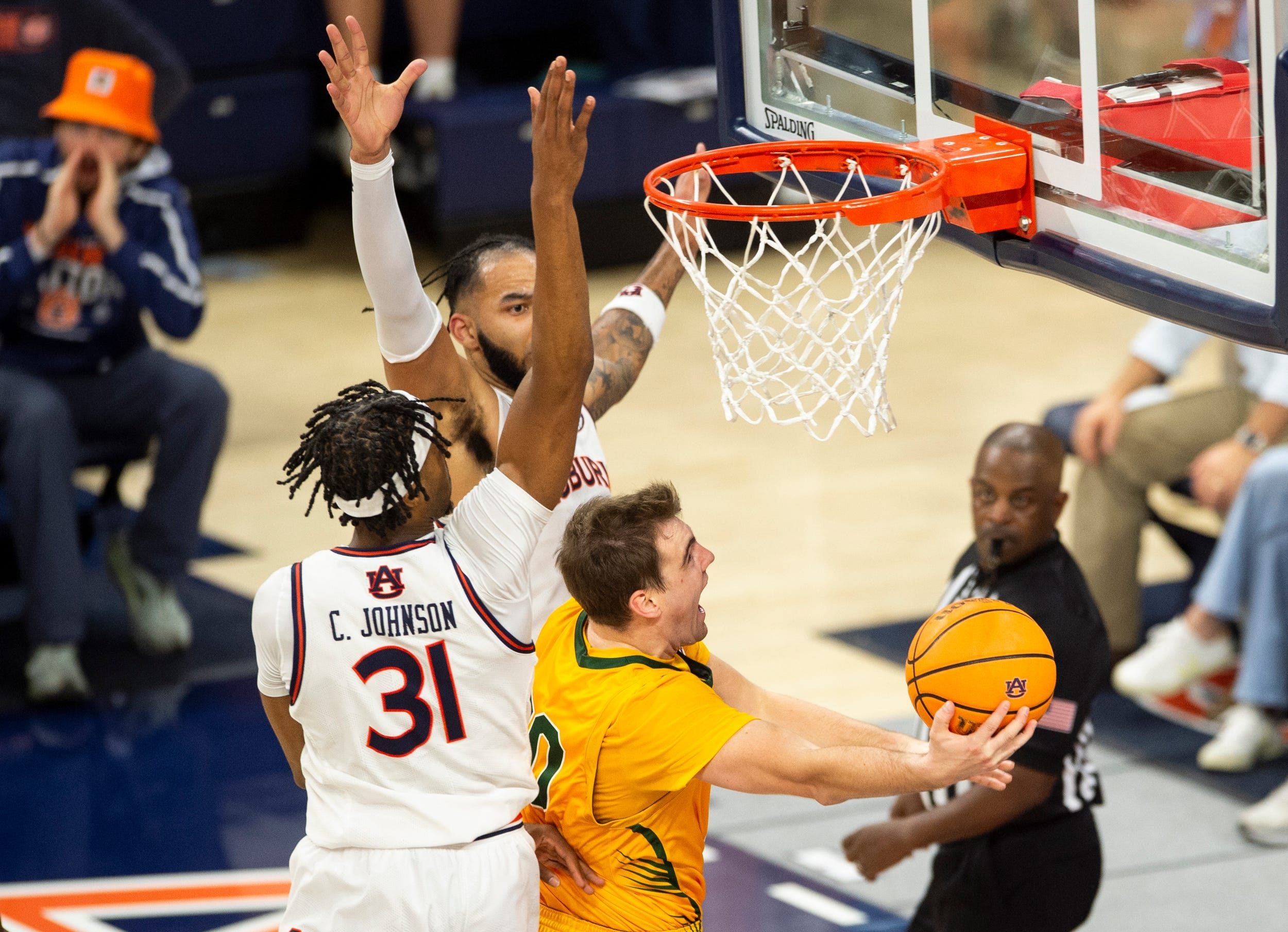 Vermont Catamounts guard TJ Long (20) goes up for a layup as Auburn Tigers take on Vermont Catamounts at Neville Arena in Auburn, Ala., on Wednesday, Nov. 6, 2024. Auburn Tigers defeated Vermont Catamounts 94-43.