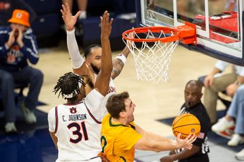 Vermont Catamounts guard TJ Long (20) goes up for a layup as Auburn Tigers take on Vermont Catamounts at Neville Arena in Auburn, Ala., on Wednesday, Nov. 6, 2024. Auburn Tigers defeated Vermont Catamounts 94-43.