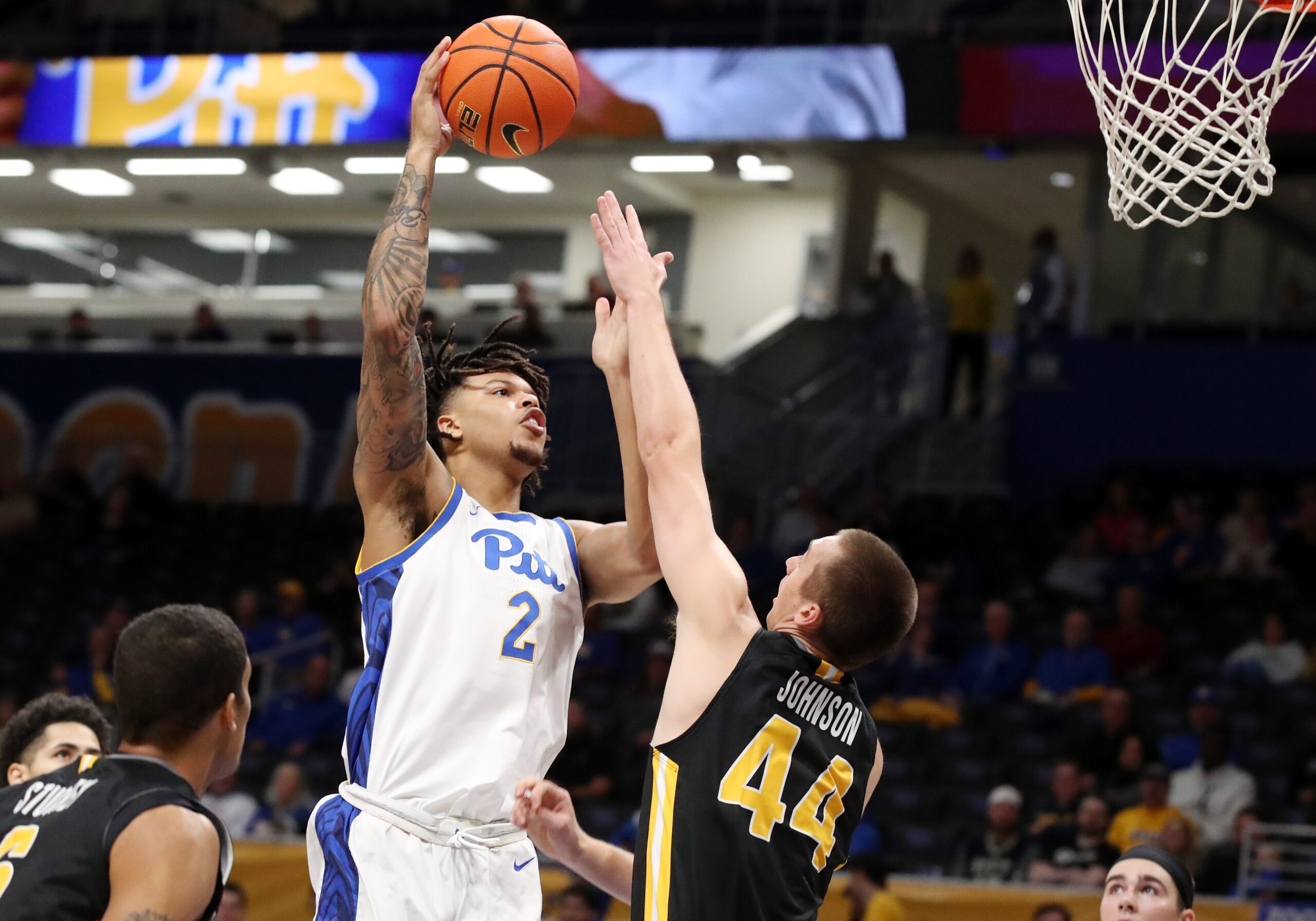 Nov 18, 2024; Pittsburgh, Pennsylvania, USA;  Pittsburgh Panthers forward Cameron Corhen (2) shoots against Virginia Military Keydets forward TJ Johnson (44) during the first half at the Petersen Events Center. Mandatory Credit: Charles LeClaire-Imagn Images