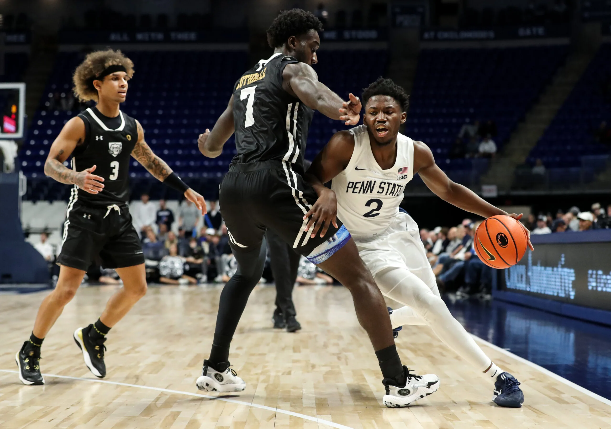 Nov 20, 2024; University Park, Pennsylvania, USA; Penn State Nittany Lions guard D'Marco Dunn (2) attempts to dribble the ball around Purdue Fort Wayne Mastodons forward Chandler Cuthrell (7) during the first half at Bryce Jordan Center. Mandatory Credit: Matthew O'Haren-Imagn Images