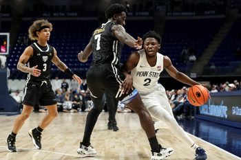Nov 20, 2024; University Park, Pennsylvania, USA; Penn State Nittany Lions guard D'Marco Dunn (2) attempts to dribble the ball around Purdue Fort Wayne Mastodons forward Chandler Cuthrell (7) during the first half at Bryce Jordan Center. Mandatory Credit: Matthew O'Haren-Imagn Images