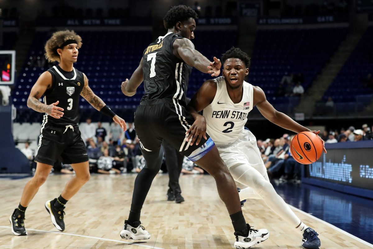 Nov 20, 2024; University Park, Pennsylvania, USA; Penn State Nittany Lions guard D'Marco Dunn (2) attempts to dribble the ball around Purdue Fort Wayne Mastodons forward Chandler Cuthrell (7) during the first half at Bryce Jordan Center. Mandatory Credit: Matthew O'Haren-Imagn Images