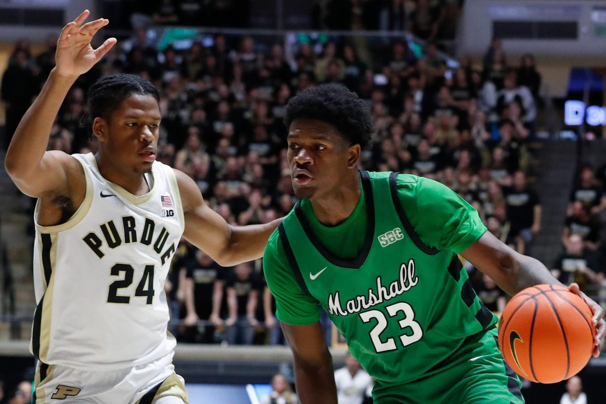 Purdue Boilermakers guard Gicarri Harris (24) defends Marshall Thundering Herd guard Mikal Dawson (23) Saturday, Nov. 23, 2024, during the NCAA men’s basketball game at Mackey Arena in West Lafayette, Ind.