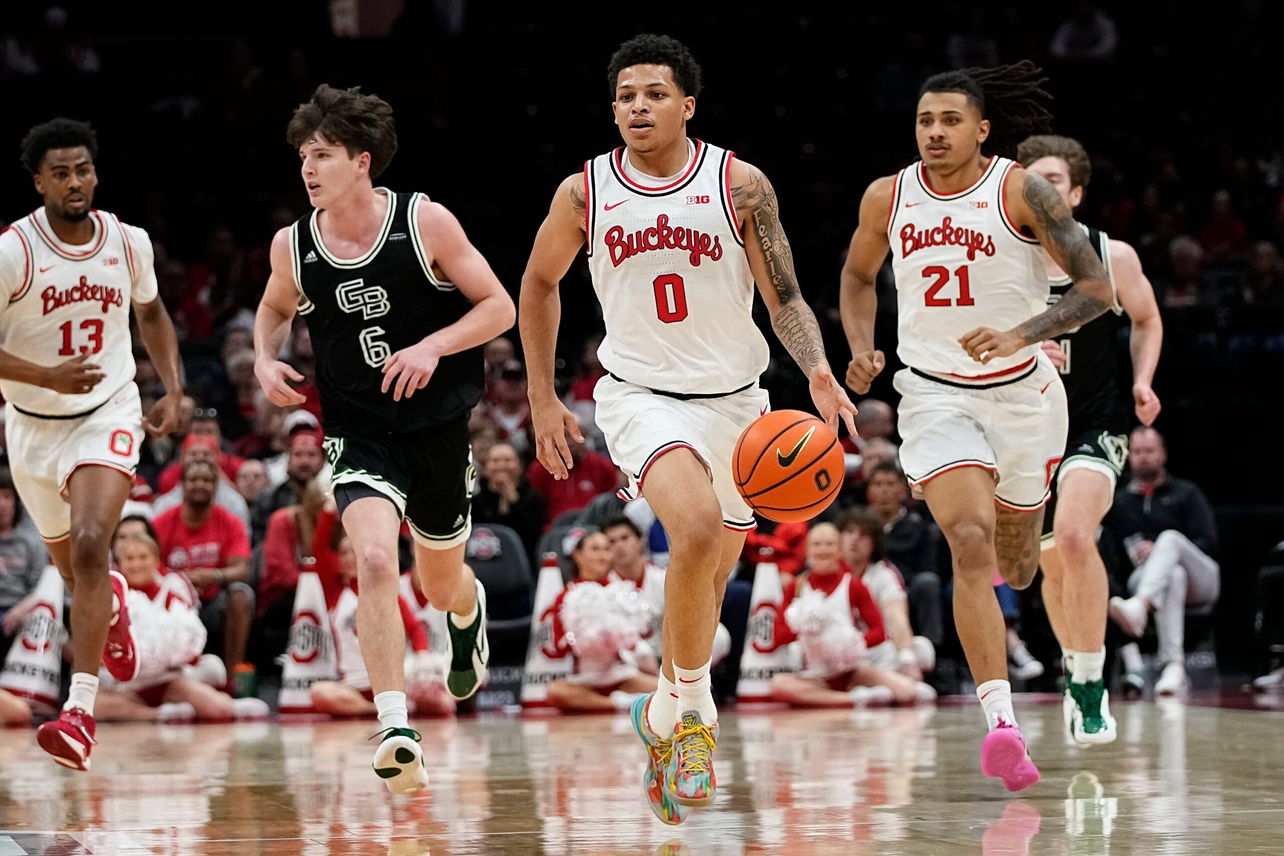 Ohio State Buckeyes guard John Mobley Jr. (0) leads his team up the court during the first half of the NCAA men's basketball game against the Green Bay Phoenix at Value City Arena in Columbus on Monday, Nov. 25, 2024. Ohio State won 102-69.