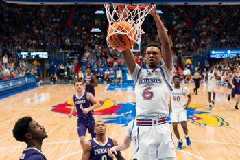 Nov 30, 2024; Lawrence, Kansas, USA; Kansas Jayhawks guard Rylan Griffen (6) dunks the ball during the second half against the Furman Paladins at Allen Fieldhouse. Mandatory Credit: Jay Biggerstaff-Imagn Images