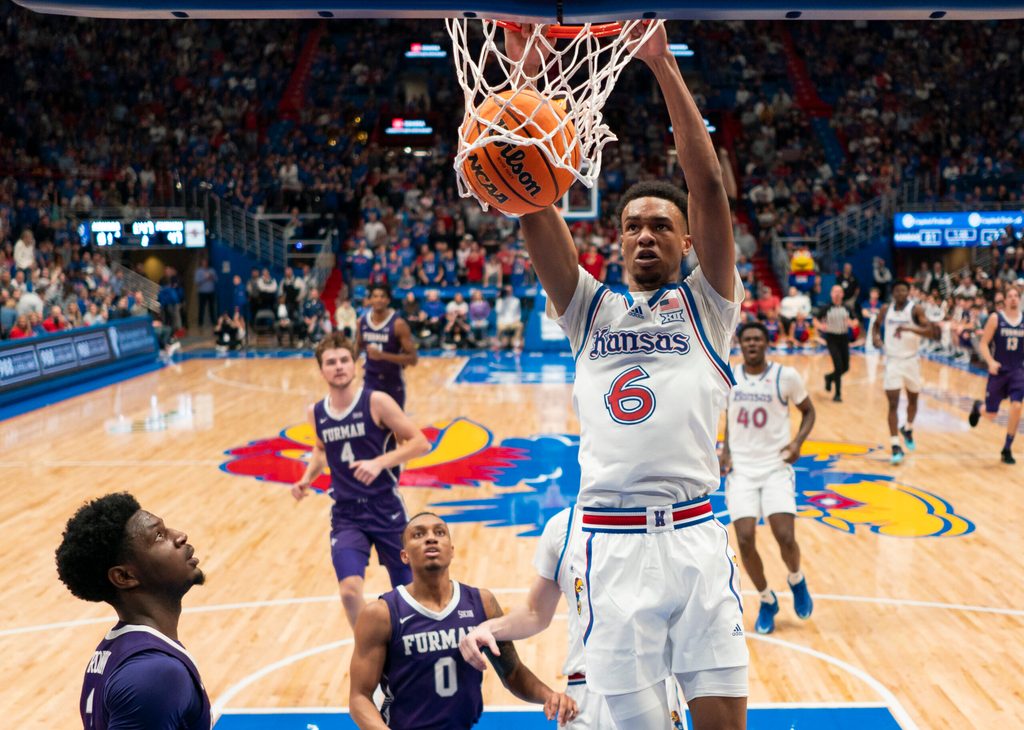 Nov 30, 2024; Lawrence, Kansas, USA; Kansas Jayhawks guard Rylan Griffen (6) dunks the ball during the second half against the Furman Paladins at Allen Fieldhouse. Mandatory Credit: Jay Biggerstaff-Imagn Images