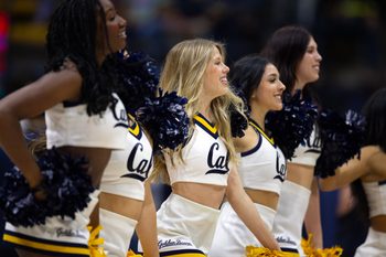 Dec 7, 2024; Berkeley, California, USA; The California Golden Bears cheerleaders entertain the crowd during a timeout in the first half against the Stanford Cardinal at Haas Pavilion. Mandatory Credit: D. Ross Cameron-Imagn Images
