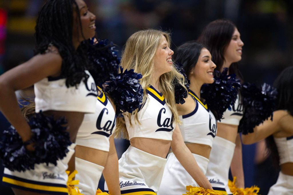 Dec 7, 2024; Berkeley, California, USA; The California Golden Bears cheerleaders entertain the crowd during a timeout in the first half against the Stanford Cardinal at Haas Pavilion. Mandatory Credit: D. Ross Cameron-Imagn Images