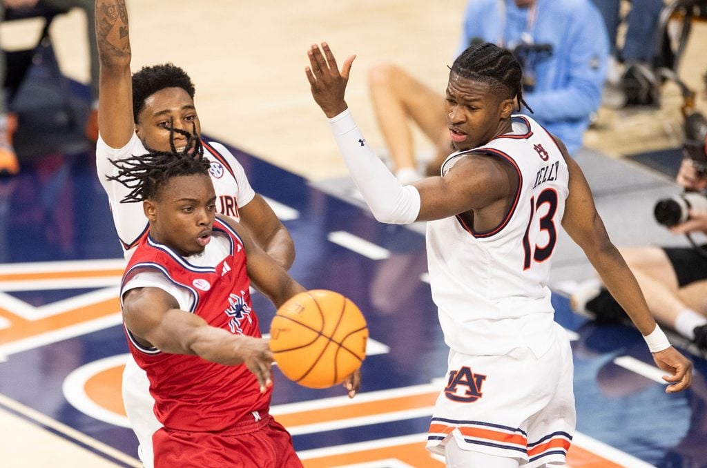 Richmond Spiders guard Mikkel Tyne (1) passes out as Auburn Tigers take on Richmond Spiders at Neville Arena in Auburn, Ala., on Saturday, Dec. 8, 2024. Auburn Tigers defeated Richmond Spiders 98-54.
