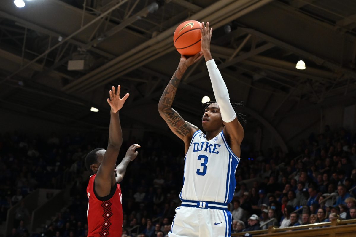 Dec 10, 2024; Durham, North Carolina, USA;  Duke Blue Devils forward Isaiah Evans (3) shoots over Incarnate Word Cardinals guard Davion Bailey (5) during the second half at Cameron Indoor Stadium. Mandatory Credit: Rob Kinnan-Imagn Images