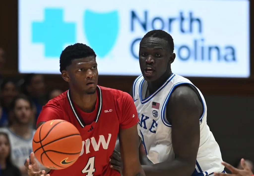 Dec 10, 2024; Durham, North Carolina, USA; Incarnate Word Cardinals forward Jayden Williams (4) looks to pass as Duke Blue Devils center Khaman Maluach (9) defends during the second half at Cameron Indoor Stadium. Mandatory Credit: Rob Kinnan-Imagn Images