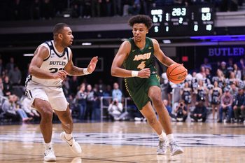 Dec 10, 2024; Indianapolis, Indiana, USA; North Dakota State Bison forward Jacksen Moni (4) drives to the basket against Butler Bulldogs forward Pierre Brooks II (21) during the second half at Hinkle Fieldhouse. Mandatory Credit: Robert Goddin-Imagn Images
