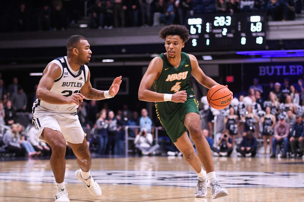 Dec 10, 2024; Indianapolis, Indiana, USA; North Dakota State Bison forward Jacksen Moni (4) drives to the basket against Butler Bulldogs forward Pierre Brooks II (21) during the second half at Hinkle Fieldhouse. Mandatory Credit: Robert Goddin-Imagn Images