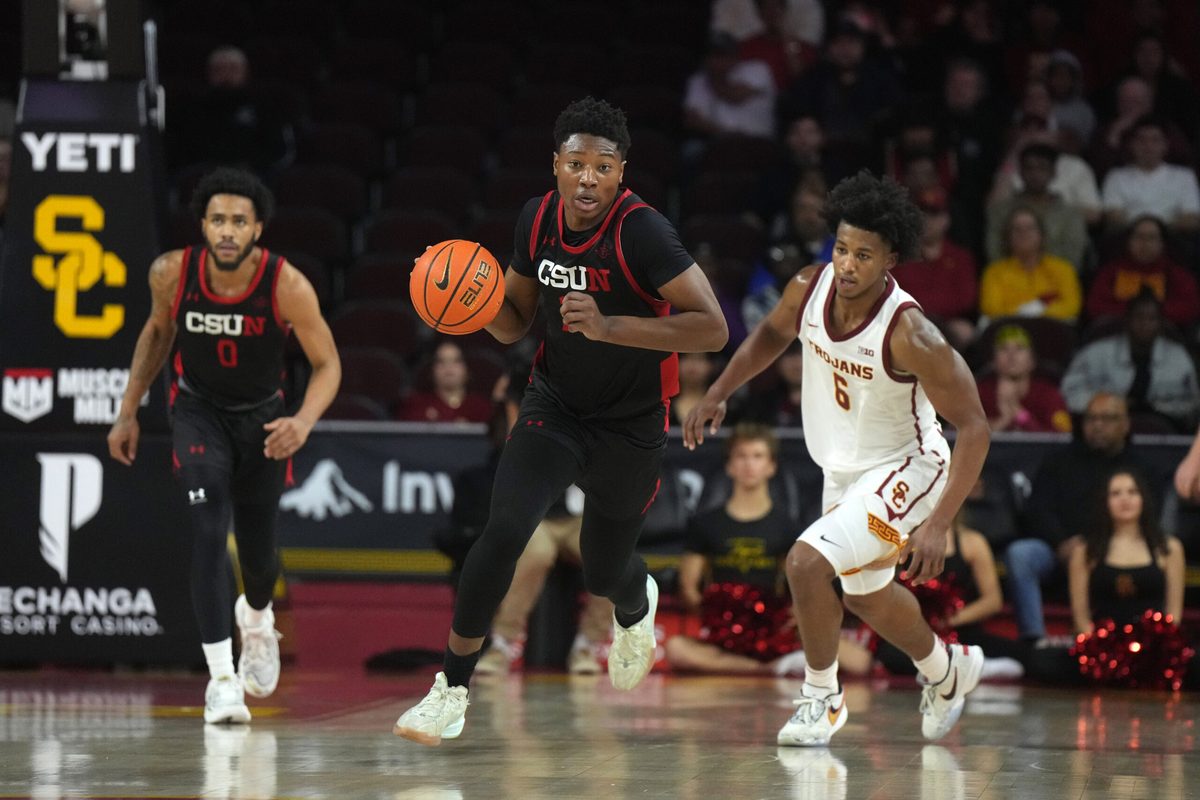 Dec 18, 2024; Los Angeles, California, USA; Cal State Northridge Matadors forward Mahmoud Fofana (11) dribbles the ball against the Southern California Trojans in the first half at Galen Center. Mandatory Credit: Kirby Lee-Imagn Images
