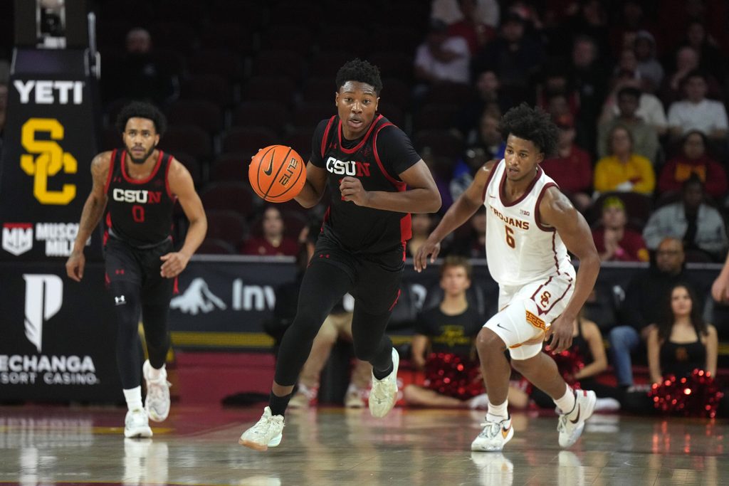 Dec 18, 2024; Los Angeles, California, USA; Cal State Northridge Matadors forward Mahmoud Fofana (11) dribbles the ball against the Southern California Trojans in the first half at Galen Center. Mandatory Credit: Kirby Lee-Imagn Images