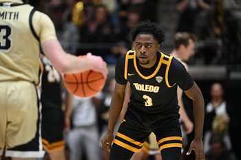 Dec 29, 2024; West Lafayette, Indiana, USA; Toledo Rockets guard Sonny Wilson (3) watches a ball controlled by Purdue Boilermakers guard Braden Smith (3) during the first half at Mackey Arena. Mandatory Credit: Marc Lebryk-Imagn Images