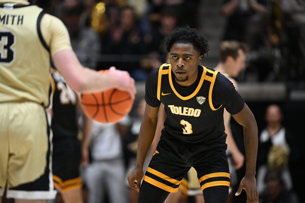 Dec 29, 2024; West Lafayette, Indiana, USA; Toledo Rockets guard Sonny Wilson (3) watches a ball controlled by Purdue Boilermakers guard Braden Smith (3) during the first half at Mackey Arena. Mandatory Credit: Marc Lebryk-Imagn Images