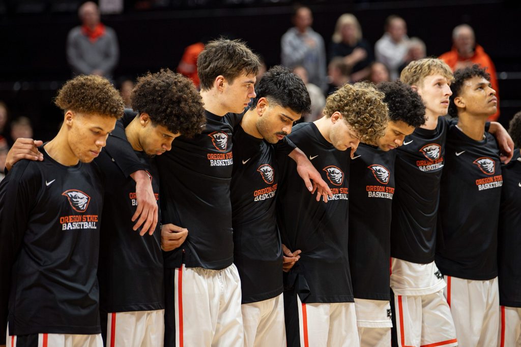 The Oregon State men's basketball team listens to the national anthem before facing San Diego in a NCAA basketball game at Gill Coliseum on Saturday, Jan. 4, 2025, in Corvallis, Ore.