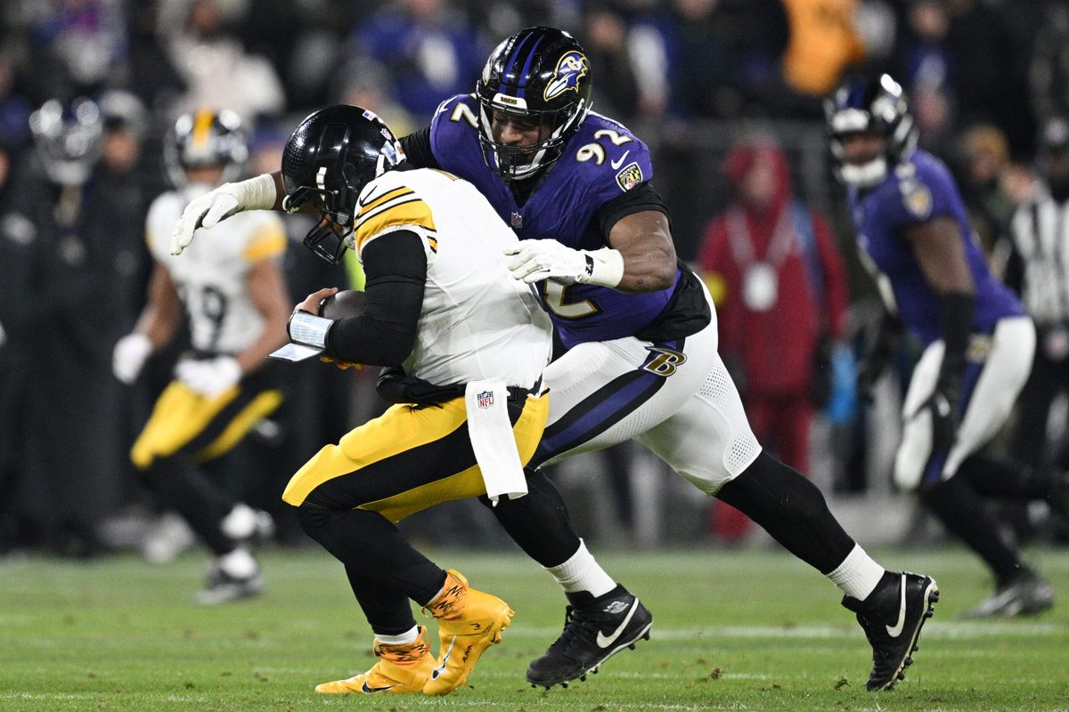 Jan 11, 2025; Baltimore, Maryland, USA; Baltimore Ravens defensive tackle Nnamdi Madubuike (92) tackles Pittsburgh Steelers quarterback Russell Wilson (3) in the third quarter in an AFC wild card game at M&T Bank Stadium. Mandatory Credit: Tommy Gilligan-Imagn Images