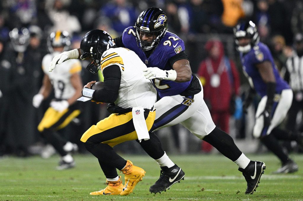 Jan 11, 2025; Baltimore, Maryland, USA; Baltimore Ravens defensive tackle Nnamdi Madubuike (92) tackles Pittsburgh Steelers quarterback Russell Wilson (3) in the third quarter in an AFC wild card game at M&T Bank Stadium. Mandatory Credit: Tommy Gilligan-Imagn Images