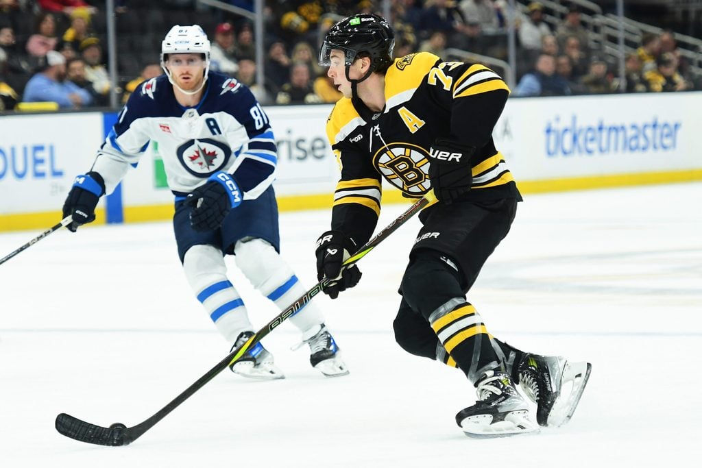 Jan 30, 2025; Boston, Massachusetts, USA; Boston Bruins defenseman Charlie McAvoy (73) skates with the puck during the third period against the Winnipeg Jets at TD Garden. Mandatory Credit: Bob DeChiara-Imagn Images