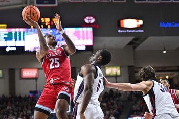 Feb 6, 2025; Spokane, Washington, USA; Loyola Marymount Lions forward Caleb Stone-Carrawell (25) shoots against Gonzaga Bulldogs forward Emmanuel Innocenti (5) in the second half at McCarthey Athletic Center. Gonzaga Bulldogs won 73-53. Mandatory Credit: James Snook-Imagn Images