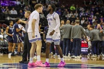 Feb 23, 2025; Newark, New Jersey, USA;  Seton Hall Pirates forward Gus Yalden (19) reacts to a play with forward Prince Aligbe (4) during a timeout against the Xavier Musketeers at Prudential Center. Mandatory Credit: Scott Rausenberger-Imagn Images