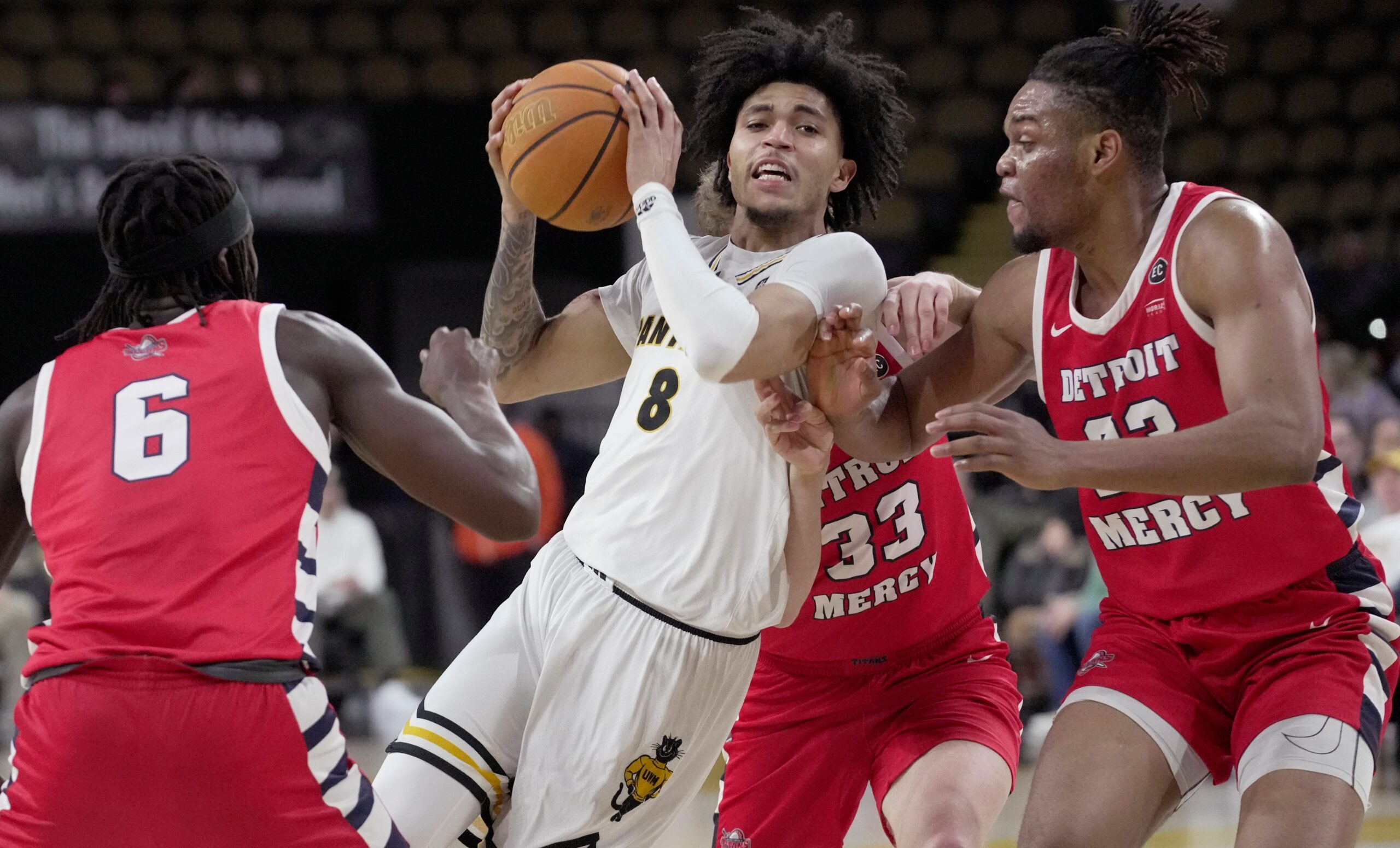 UW-Milwaukee guard Erik Pratt (8) is swarmed during the first half of their game against Detroit Mercy Saturday, March 1, 2025 at UW-Milwaukee Panther Arena in Milwaukee, Wisconsin.