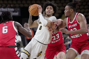 UW-Milwaukee guard Erik Pratt (8) is swarmed during the first half of their game against Detroit Mercy Saturday, March 1, 2025 at UW-Milwaukee Panther Arena in Milwaukee, Wisconsin.
