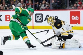 Mar 2, 2025; Saint Paul, Minnesota, USA; Minnesota Wild center Gustav Nyquist (41) shoots the puck as Boston Bruins goaltender Jeremy Swayman (1) defends during the second period at Xcel Energy Center. Mandatory Credit: Matt Krohn-Imagn Images