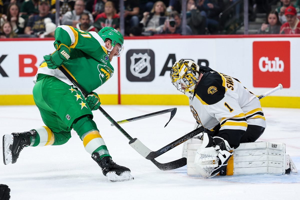 Mar 2, 2025; Saint Paul, Minnesota, USA; Minnesota Wild center Gustav Nyquist (41) shoots the puck as Boston Bruins goaltender Jeremy Swayman (1) defends during the second period at Xcel Energy Center. Mandatory Credit: Matt Krohn-Imagn Images