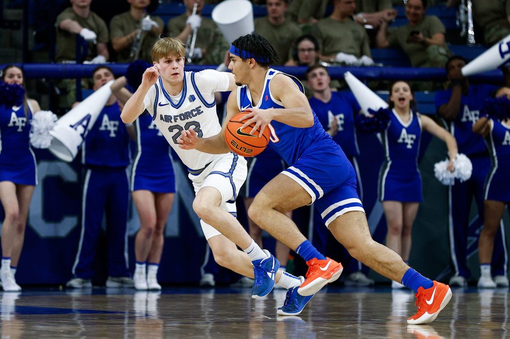 Mar 4, 2025; Colorado Springs, Colorado, USA; Boise State Broncos guard Julian Bowie (0) controls the ball as Air Force Falcons guard Sam Duskin (23) guards in the second half at Clune Arena. Mandatory Credit: Isaiah J. Downing-Imagn Images