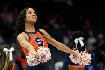 Mar 11, 2025; Charlotte, NC, USA; Syracuse Orange cheerleader performs in the second half at Spectrum Center. Mandatory Credit: Bob Donnan-Imagn Images