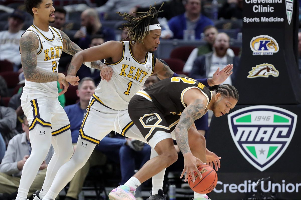 Kent State Golden Flashes guard Marquis Barnett (2) and forward VonCameron Davis (1) guard against Western Michigan Broncos guard Markhi Strickland (22) during the first half of an NCAA college basketball game in the quarterfinals of the Mid-American Conference Tournament at Rocket Arena on Thursday, March 13, 2025, in Cleveland, Ohio.