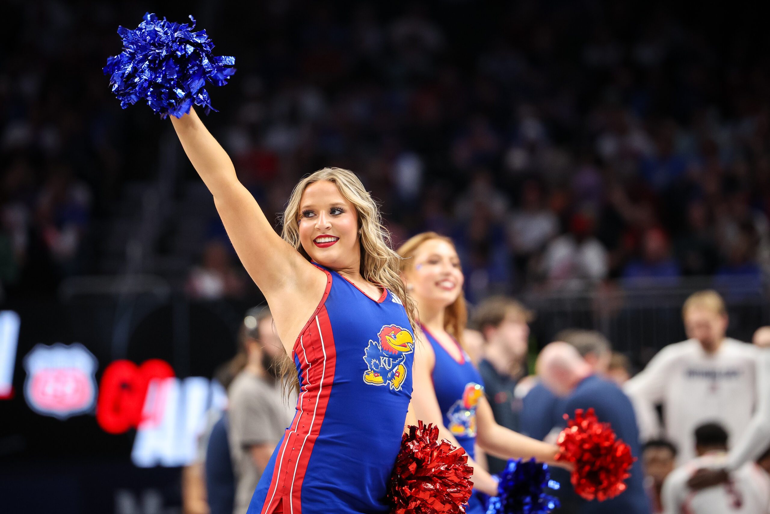 Mar 13, 2025; Kansas City, MO, USA; Kansas Jayhawks cheerleaders performs during the first half against the Arizona Wildcats at T-Mobile Center. Mandatory Credit: William Purnell-Imagn Images