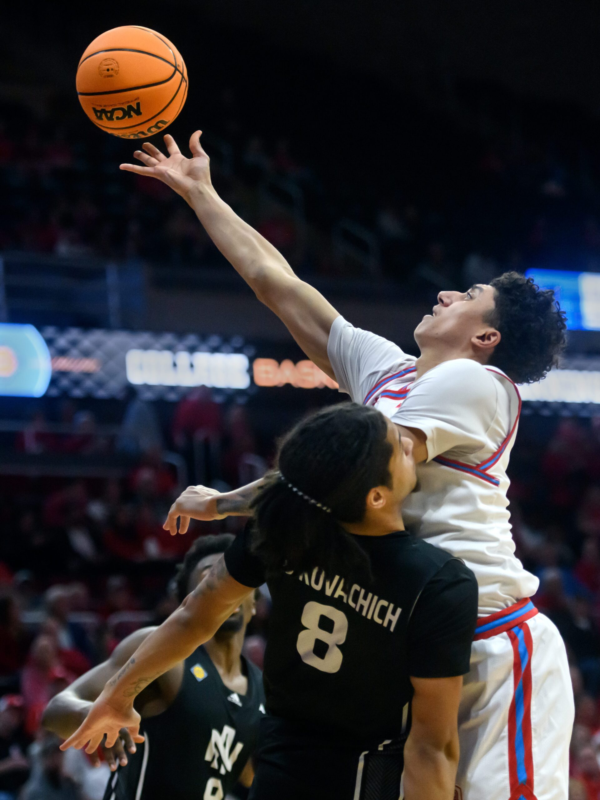 Bradley’s Christian Davis, top, puts up an underhanded shot over North Alabama’s Kevin de Kovachich in the first half of their first-round NIT basketball game Wednesday, March 19, 2025. The Braves advanced with a 71-62 victory.