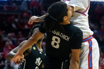 Bradley’s Christian Davis, top, puts up an underhanded shot over North Alabama’s Kevin de Kovachich in the first half of their first-round NIT basketball game Wednesday, March 19, 2025. The Braves advanced with a 71-62 victory.