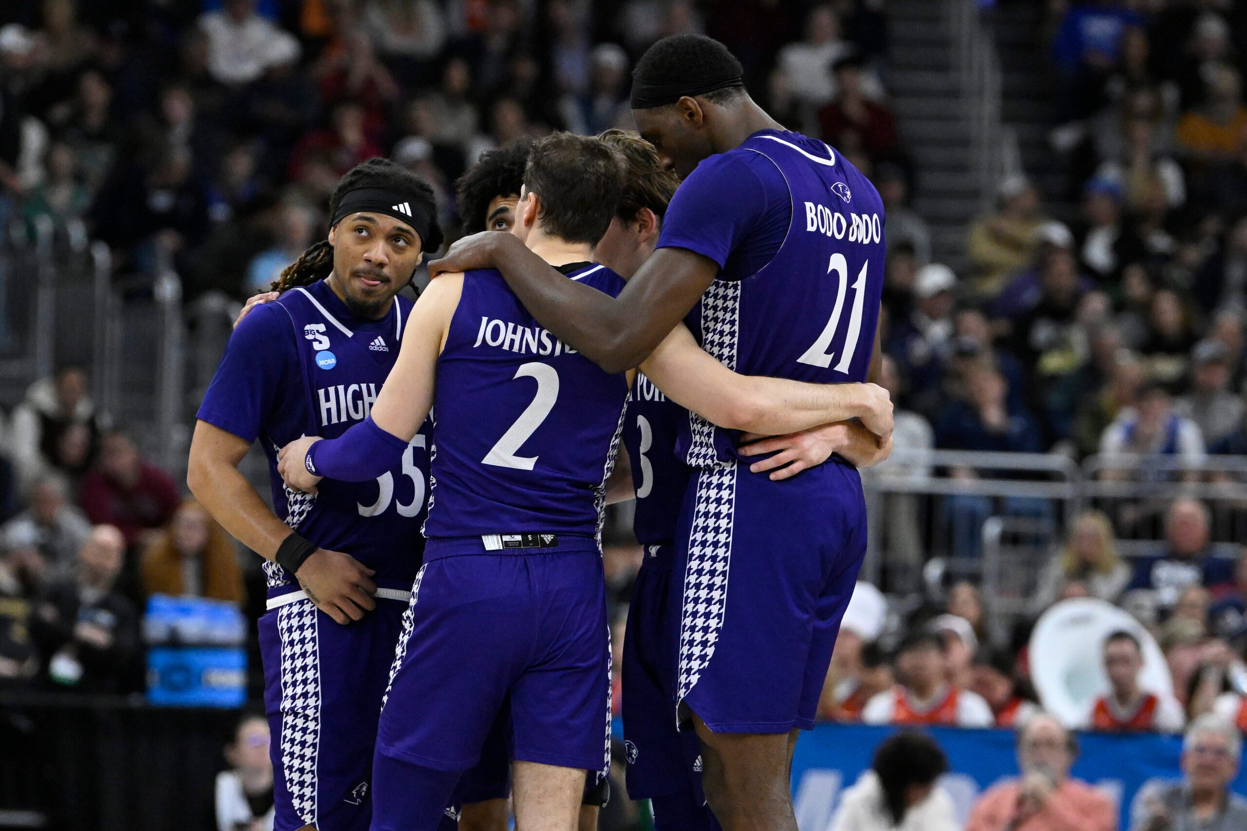 Mar 20, 2025; Providence, RI, USA; High Point Panthers guard Bobby Pettiford (55) and guard Chase Johnston (2) and forward Juslin Bodo Bodo (21) huddle with teammates during the second half against the Purdue Boilermakers at Amica Mutual Pavilion. Mandatory Credit: Eric Canha-Imagn Images