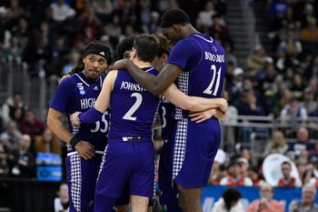 Mar 20, 2025; Providence, RI, USA; High Point Panthers guard Bobby Pettiford (55) and guard Chase Johnston (2) and forward Juslin Bodo Bodo (21) huddle with teammates during the second half against the Purdue Boilermakers at Amica Mutual Pavilion. Mandatory Credit: Eric Canha-Imagn Images