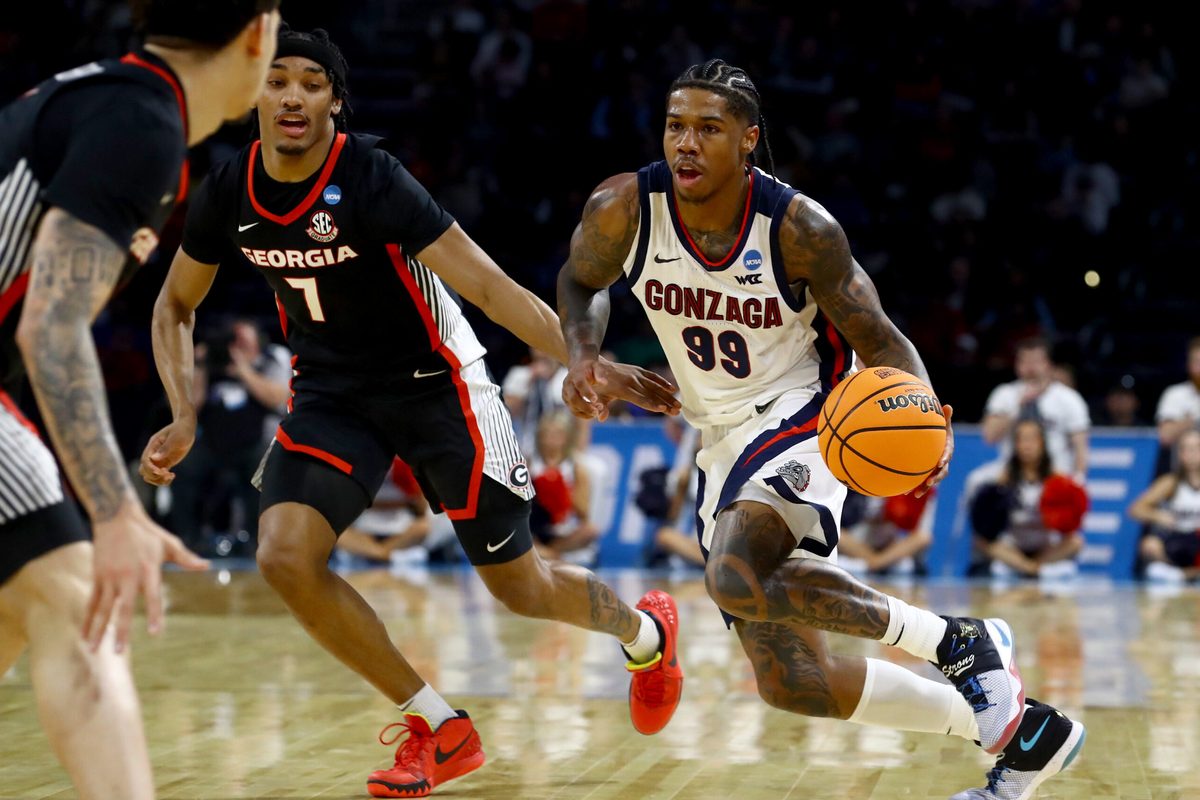 Mar 20, 2025; Wichita, KS, USA; Gonzaga Bulldogs guard Khalif Battle (99) dribbles against Georgia Bulldogs guard Tyrin Lawrence (7) in the second half of a first round men’s NCAA Tournament game at Intrust Bank Arena. Mandatory Credit: Nick Tre. Smith-Imagn Images