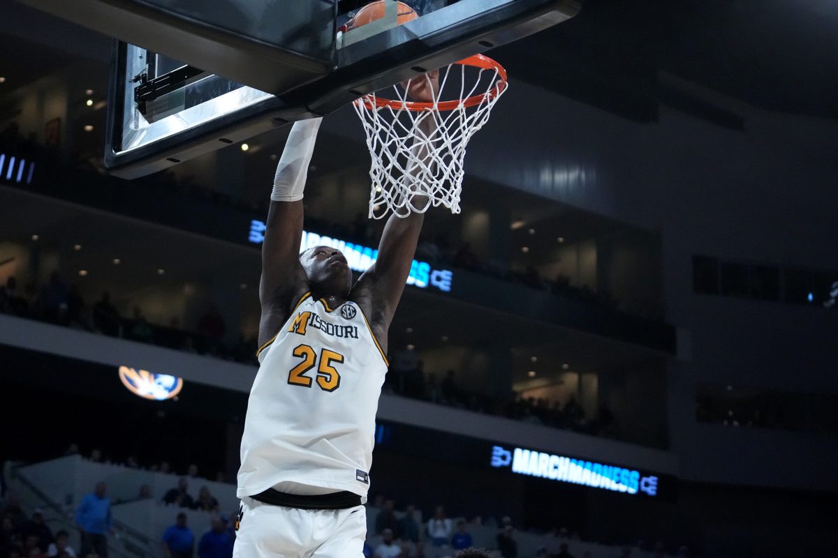 Mar 20, 2025; Wichita, KS, USA; Missouri Tigers guard Mark Mitchell (25) dunks in the second half of a first round men’s NCAA Tournament game Drake Bulldogs at Intrust Bank Arena. Mandatory Credit: Kirby Lee-Imagn Images