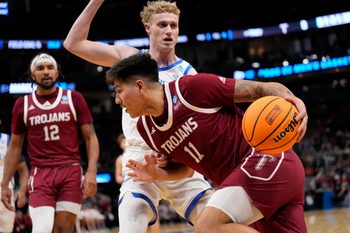 Mar 21, 2025; Milwaukee, WI, USA; Troy Trojans forward Victor Valdes (11) drives to the hoop past Kentucky Wildcats guard Collin Chandler (5) during the first half at Fiserv Forum. Mandatory Credit: Jeff Hanisch-Imagn Images