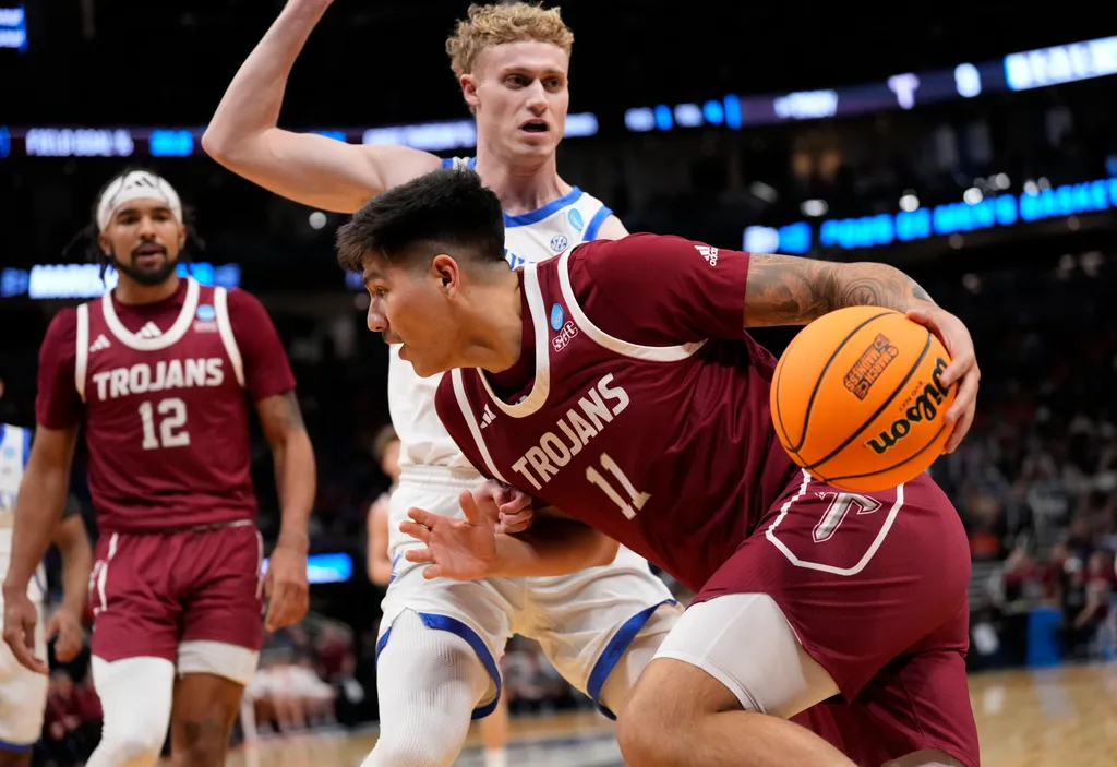 Mar 21, 2025; Milwaukee, WI, USA; Troy Trojans forward Victor Valdes (11) drives to the hoop past Kentucky Wildcats guard Collin Chandler (5) during the first half at Fiserv Forum. Mandatory Credit: Jeff Hanisch-Imagn Images
