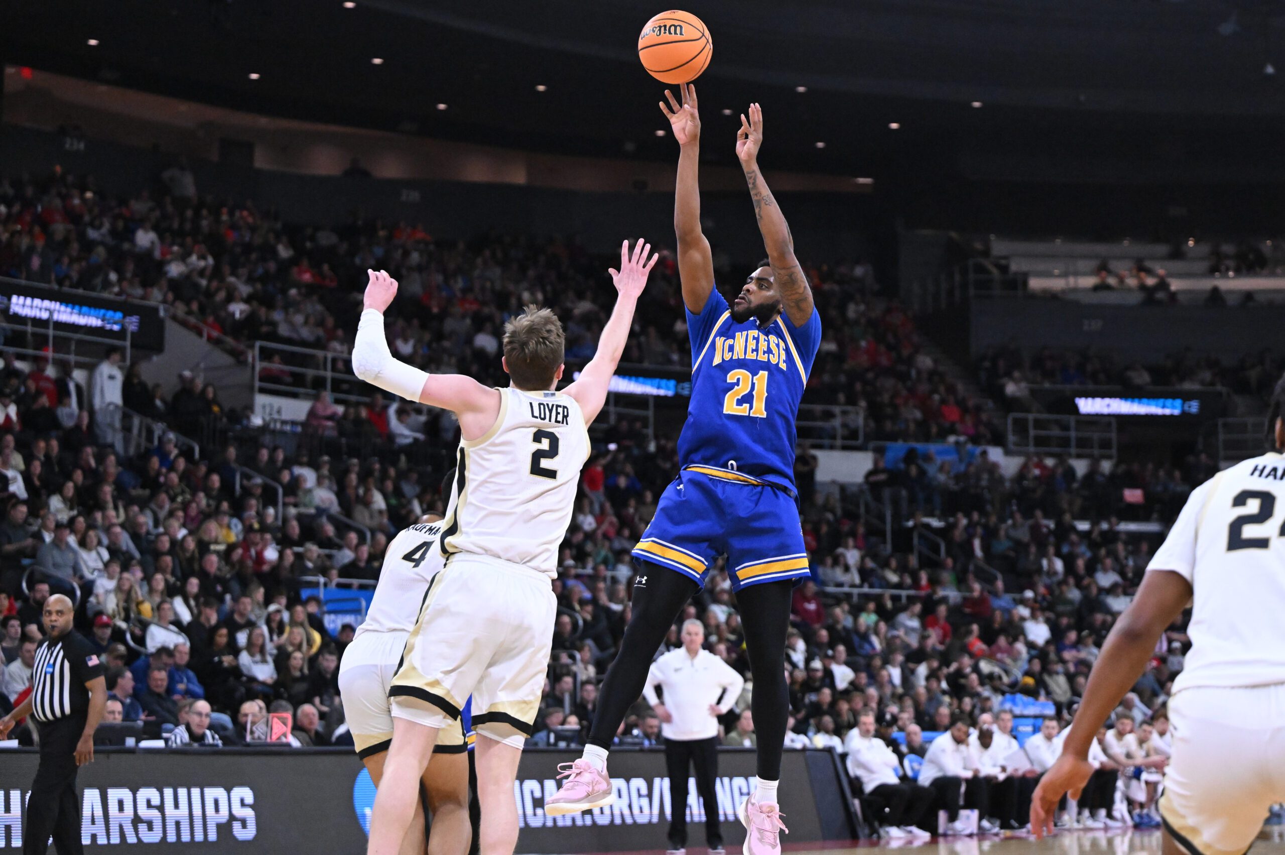 Mar 22, 2025; Providence, RI, USA; McNeese State Cowboys guard Sincere Parker (21) shoots against Purdue Boilermakers guard Fletcher Loyer (2) during the second half of a second round men’s NCAA Tournament game at Amica Mutual Pavilion. Mandatory Credit: Brian Fluharty-Imagn Images