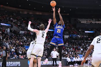 Mar 22, 2025; Providence, RI, USA; McNeese State Cowboys guard Sincere Parker (21) shoots against Purdue Boilermakers guard Fletcher Loyer (2) during the second half of a second round men’s NCAA Tournament game at Amica Mutual Pavilion. Mandatory Credit: Brian Fluharty-Imagn Images